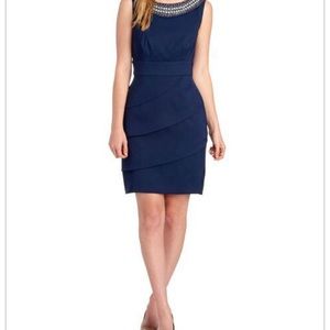 Tiered pearl collar sleeveless dress.